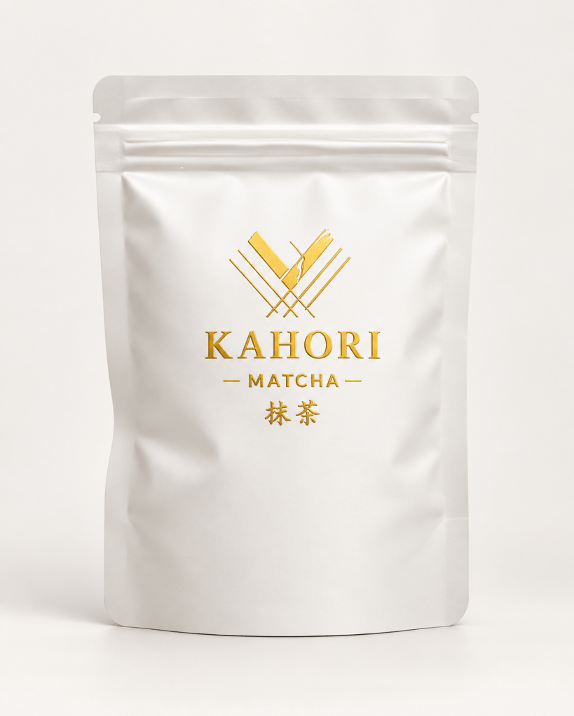 Packaging of Kahori Matcha featuring a minimalist white design with a gold logo and text